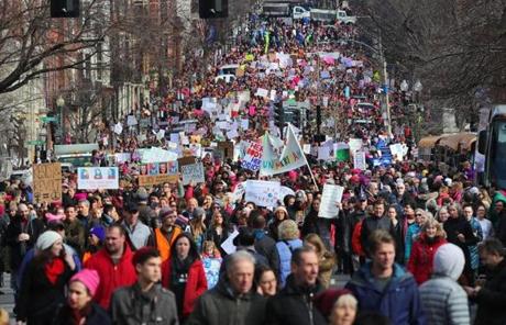 Thousands of people march down Beacon Street during the Boston Women?s March for America.
